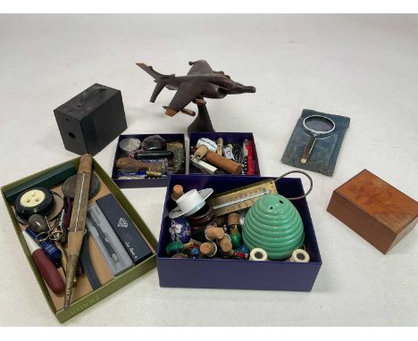 A collectors' lot including fossils, bottle stoppers in form of ducks, trinket boxes, thermometers, a carved sea harrier, bot