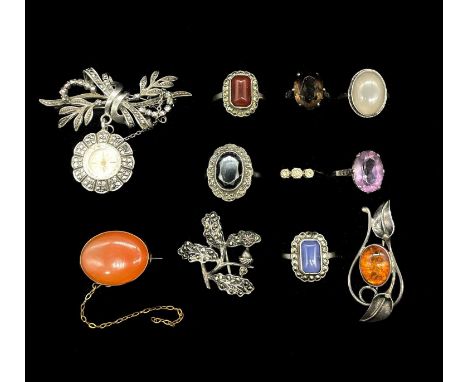 A small group of silver dress rings, a 9ct yellow gold ring, a cameo brooch, an amber set silver brooch and a marcasite set n