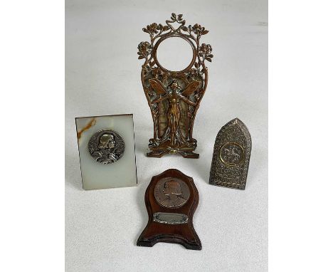 An Art Nouveau copper and brass photograph frame decorated with a fairy, height 21cm, an onyx easel backed plaque depicting J