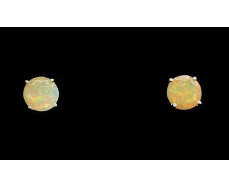 A pair of 9ct white gold opal ear studs, approx 1.07g.