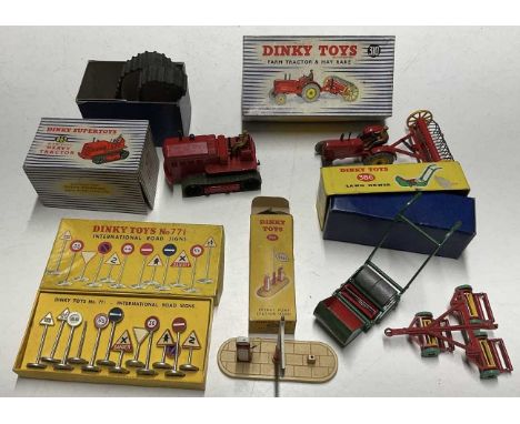 DINKY; tractors and signs, a 310 farm tractor and hay rake set, 963 heavy tractor, 386 lawn mower, 771 road signs, 781 petrol