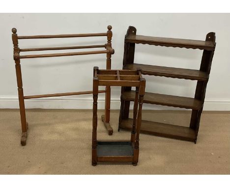 An oak wall hanging open book shelf, 82 x 60cm, together with an oak umbrella/stick stand, 63 x 31 x 20cm, and a pine towel r