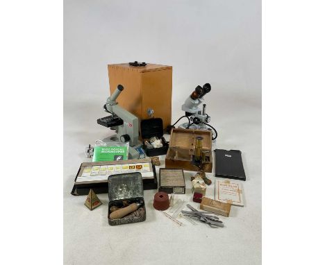 A collection of microscopes, including two electric examples, a brass microscope, a quantity of microscope plates and slides 