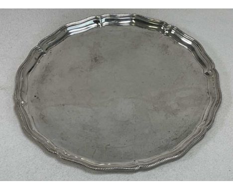 R &amp; W SORLEY; a George V hallmarked silver salver with bead detail to the rim, London 1933, diameter 24.5cm, approx 16.38