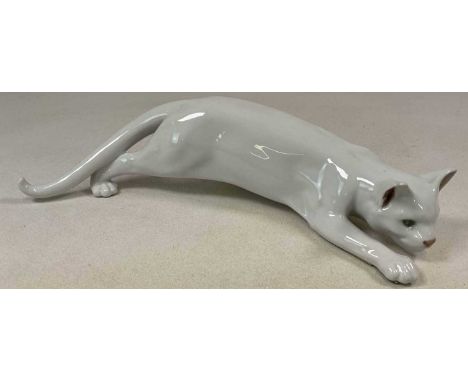 ROYAL COPENHAGEN; a white glazed tom cat in the hunting position, 47cm.Condition Report: The feet have had protective strip's