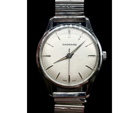 GARRARD; a gentleman's vintage stainless steel wristwatch, with baton markers to the circular dial, diameter 32mm, presented 