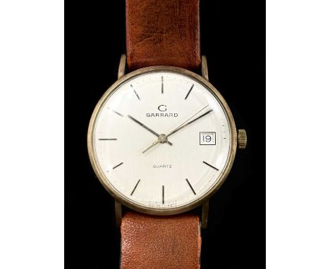 GARRARD; a gentleman's vintage 9ct yellow gold quartz wristwatch, with date aperture and baton markers to the circular dial a