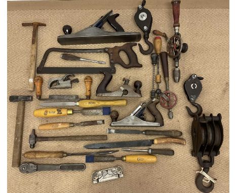 A collectors' lot of tools, to include planes, chisels, pulleys and hand drills etc.