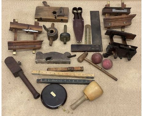 A small amount of wood working tools, to include yard sticks and measuring rulers, shears, and a pair of vintage cricket ball