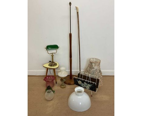 A collection of various lighting, comprising oil lamp shades, banker's desk lamp, teak floor lamp, height 140cm, together wit