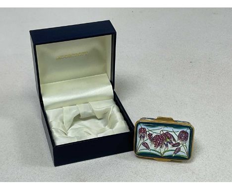 MOORCROFT; an enamel 'Fritillary' design trinket box, length 6cm, in original box.