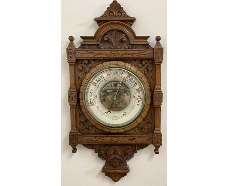 A late Victorian carved oak barometer, 67 x 33 cm