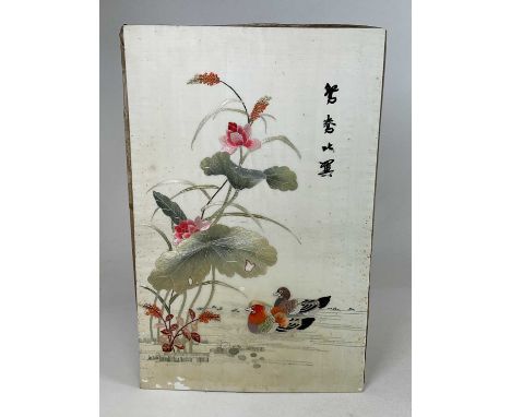 A Japanese silk embroidery depicting flowers and exotic birds, 64 x 42cm.