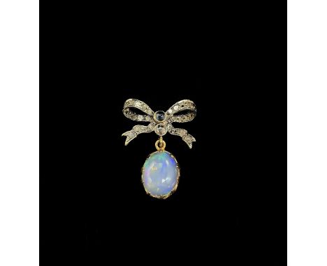 A 14ct yellow gold and silver gilt diamond, sapphire and opal pendant with delicate tied bow brooch set with twenty-seven ros