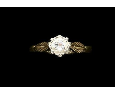 An 18ct yellow gold platinum tipped diamond solitaire ring, the round brilliant cut stone weighing approx 0.33ct, size O, app