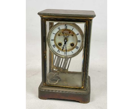 MAPLE &amp; CO, PARIS; a brass four glass mantle clock with enamel chapter ring and mercury pendulum, height 28cm.