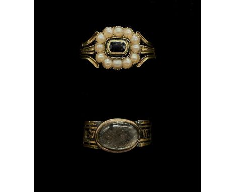 A George IV 18ct yellow gold seed pearl black onyx and black enamelled mourning ring, indistinctly inscribed '?? Borrodaile d
