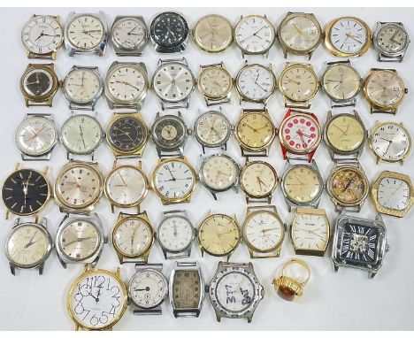 A large collection of vintage wristwatch heads including Technos, Lonstar, Emka, etc.