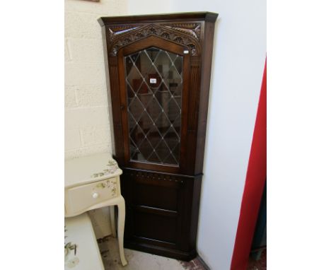 Carved oak and leaded light corner cabinet