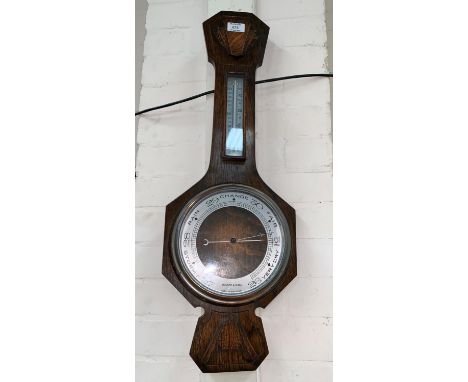A 1930's oak cased aneroid barometer by Walker &amp; Hall 