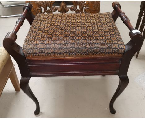 An Edwardian mahogany piano stool on cabriole legs with turned handles and hinged lid 