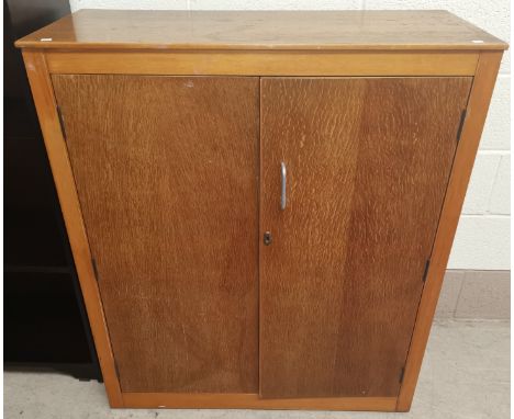 A mid 20th century light oak double cupboard, Height 42" x 36" x 15" 