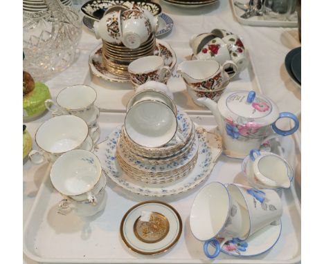 A Shelley hand painted tea pot, 2 cups, 2 saucers, milk and sugar reg 781613 and a selection of other tea ware