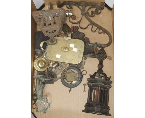 A cast iron light bracket of Gothic design; other metalware 