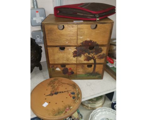 A black lacquered wall shelf unit; an oriental 6 drawer cabinet; a wrought iron wall light; a picnic set 
