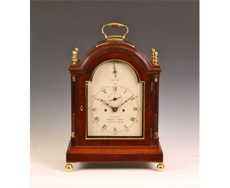 TUPMAN CHARLES STREET GROSVENOR SQUARE (LONDON)A good late George III figured Mahogany arch-top BRACKET CLOCK with folding ha