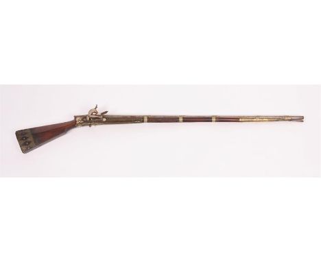 An early 19th Century Turkish FLINTLOCK RIFLE with Fruitwood stock and bound faceted steel barrel inlaid with decorative bras