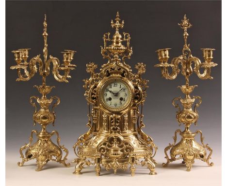 An ornate late 19th Century French Brass three piece MANTEL GARNITURE CLOCK SET with four branch Candelabra and leaf cast dec