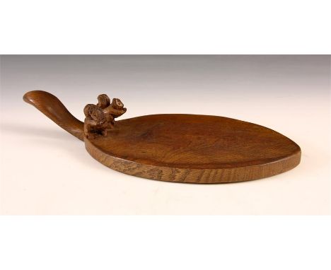 An unusual early Wilf Hutchinson (Squirrel Man) Oak CHEESE BOARD with curved handle and carved pair of squirrels 36cms across