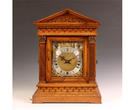 A good late 19th Century German Winterhalder &amp; Hofmeier Paladian-top carved Oak boardroom type BRACKET CLOCK with side co