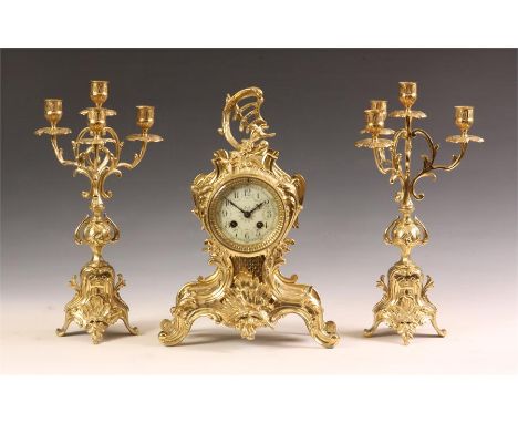 &nbsp;A late 19th Century French rococo three piece Cast Brass MANTEL GARNITURE CLOCK SET with four branch candelabra and orn