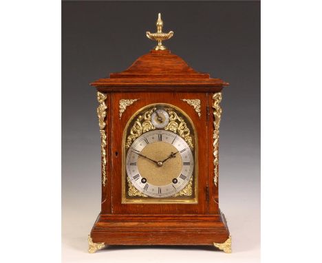 A good late 19th Century Winterhalder &amp; Hofmeier caddy-top Oak MANTEL CLOCK with caryatid corner mounts, cast feet and ur