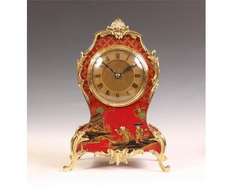 A late 19th Century French rococo style red lacquer and Chinoserie decorated MANTEL CLOCK with brass leaf cast mounts and gil
