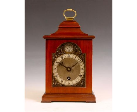 &nbsp;A small 20th Century Mahogany bell-top MANTEL CLOCK with brass handle and dial with silvered chapter ring and spandrels