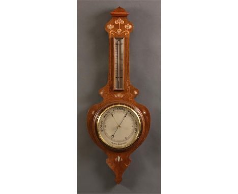 A good late 19th Century Art-Nouveau copper and mother of pearl florally inlaid Oak ANEROID BAROMETER with engraved silvered 