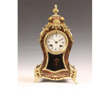 A late 19th Century Brass inlaid Red Tortoiseshell and Ebonized ground French rococo Boulle&rsquo; MANTEL CLOCK with leaf cas