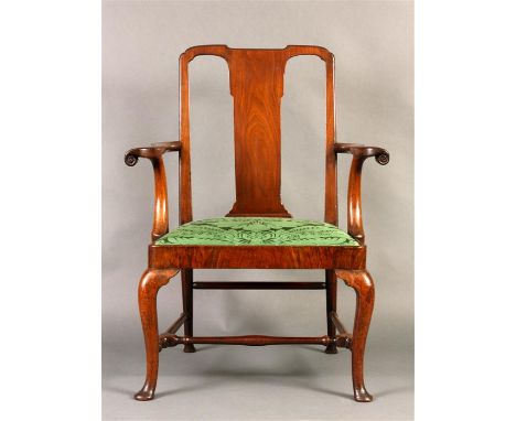 An early Georgian Walnut OPEN ARM CHAIR of generous proportions and unusual design with solid slightly tapered splat back and