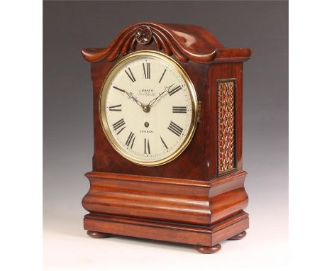J BAKER, SMITHFIELD, LONDONA&nbsp; late Regency figured Mahogany BRACKET CLOCK with carved serpentine pediment and cushion mo