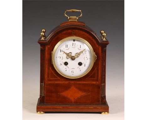 A good Edwardian inlaid Mahogany arch-top MANTEL CLOCK with folding brass handle and ball corner finials above reeded quarter