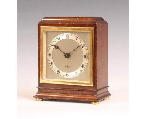 An Elliott Mahogany MANTLE CLOCK with square silvered Roman dial and eight day spring driven movement 15.5cms high