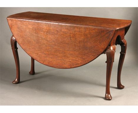 A fine mid 18th Century dense Cuban Mahogany oval drop-leaf DINING TABLE with rule joints above shaped arcaded ends raised on