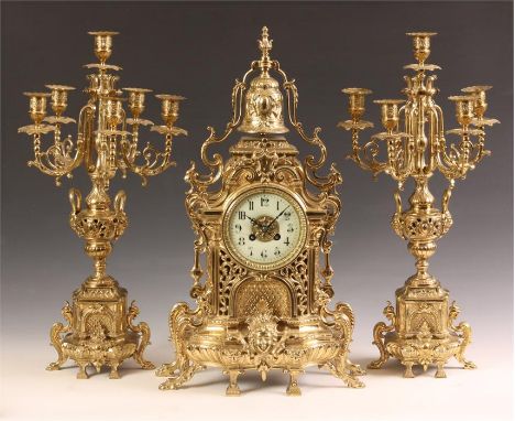 An elaborate late 19th Century French Cast Brass three piece MANTEL GARNITURE CLOCK SET with six branch Candelabra and bell s