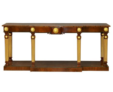A parcel gilt mahogany breakfront serving table in Regency style, by R &amp; D Davidson, London, applied with lion masks abov