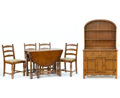 An oak canopied dresser, with linen fold panels, a set of six ladder back dining chairs and a gateleg table  Good condition