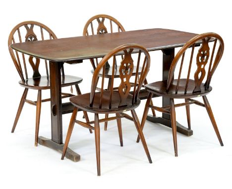 An Ercol dark stained ash dining table and set of four chairs, table 71cm h; 74 x 135cm  Wear and scratches, requiring cosmet