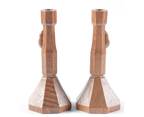 A pair of Robert 'Mouseman' Thompson oak candlesticks, of octagonal design, 22cm h, carved mouse 'signature' Both unchipped, 